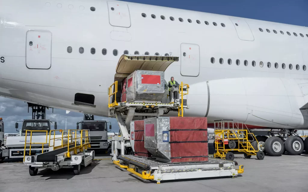 Air cargo is loaded onto a plane